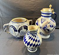 All three blue and white stoneware pieces side by side
