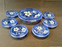 entire set of seven blue pressed glass bowls