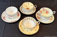 All four tea cup and saucer sets displayed top view