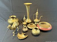 All ten brass decorative items displayed together for overview
