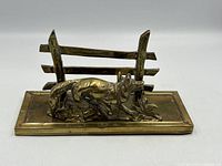 Front view showing fox, fence, and base