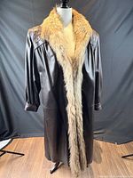 Front view of leather coat with fur collar