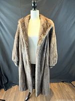 Front view of full-length mink coat on mannequin