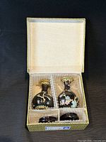 Pair of cloisonné vases on stands inside fitted box