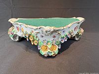 Top view showing green felt surface and floral decoration