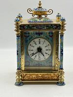 Front view showing cloisonne enamel, dial, brass frame