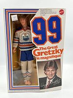 Front view of sealed box showing doll and graphics