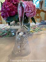 Full view of crystal bell showing handle and cut design