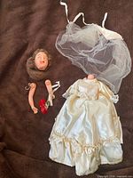 Entire disassembled bridal doll with head, arms, gown, veil