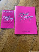Front covers of both Dirty Dancing 2008 theatre programmes showing sizes and titles