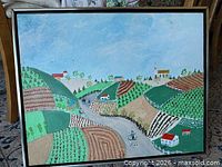 Front view of framed folk art landscape painting depicting rolling hills, farm buildings and carriage