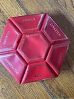 Top view showing all six labeled compartments and red vinyl finish