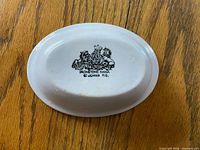 underside showing maker’s mark and full dish profile