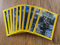 Front view of 10 fanned National Geographic magazines