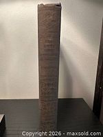 Brown cloth spine showing title and decorative embossing