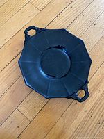 Top view showing black glass octagonal plate with two handles