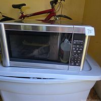 Full view of Hamilton Beach microwave on tote