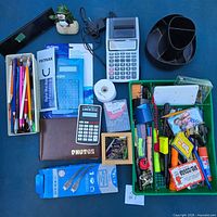 overview of all office supplies including calculators writing instruments organizers and accessories