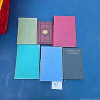 Front covers of all five books laid out