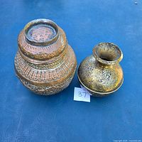 Top view of urn and vase showing shapes and engravings