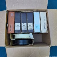 Box with six rectangular slide magazines and two round carousel trays