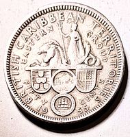 Reverse of 1955 British Caribbean Territories fifty cent coin showing coats of arms and denomination