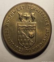 Reverse showing Northwest Territories shield and bilingual legend