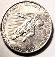 Reverse showing Time Traveler figure, mint name, dates 1999-2000