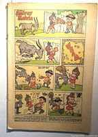 First interior page with Little Audrey and Melvin comic panels, staples visible, no exterior cover