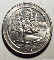 Reverse showing Common Loon, rocky shoreline, inscriptions VOYAGEURS, MINNESOTA, 2018