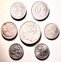 Seven coins showing reverse animal designs
