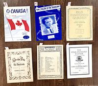 Front covers of all six sheet music booklets laid out
