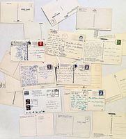 Spread of 25 postcard backs showing stamps, handwriting and blank cards