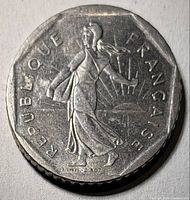 Obverse of one coin showing La Semeuse figure and République Française legend