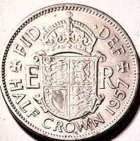 Reverse of 1957 half crown showing crowned Royal Arms shield, ER monograms, legends FID DEF HALF CROWN 1957
