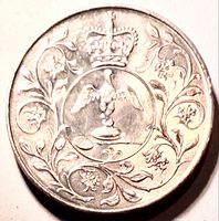 Reverse showing Ampulla, Anointing Spoon, crown, floral border