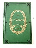 Front cover showing green cloth and gilt wreath design