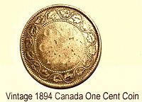 Reverse side showing denomination, date, maple leaf vine