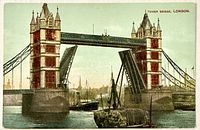 Front of postcard showing Tower Bridge with bascules raised