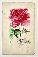 Front of postcard showing red rose illustration and caption