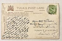 Reverse of postcard with Tuck branding, handwritten message, address