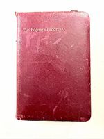 Front cover showing red leather and gilt title