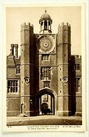Front image of postcard showing Hampton Court Palace Clock House Gateway, code B9.