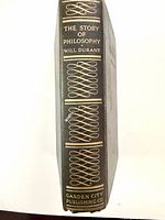 Spine view showing black cloth, gilt title and decoration