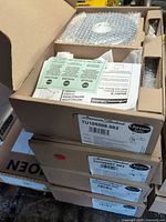 Stack of four American Standard boxed trim kits