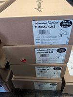 Stacked boxes showing American Standard TU105507.243 labels