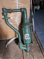 Full view of Bennett manual fuel pump showing handle and piping
