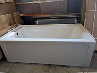 Full view of the bathtub showing overall shape and apron front