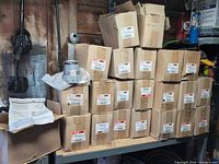 Stacked boxes labeled Cooper Crouse-Hinds TECK200-15 on shelf