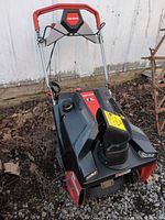 Front three-quarter view showing Craftsman snow blower with handle, chute, controls